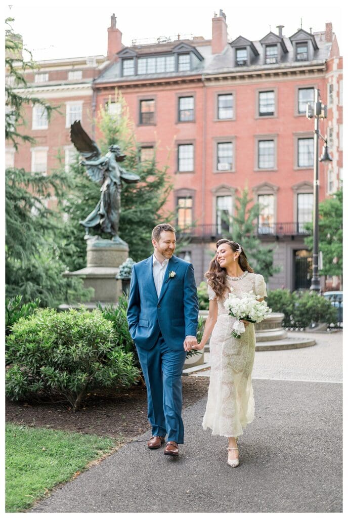 Couple strolling in the Boston Public Garden.