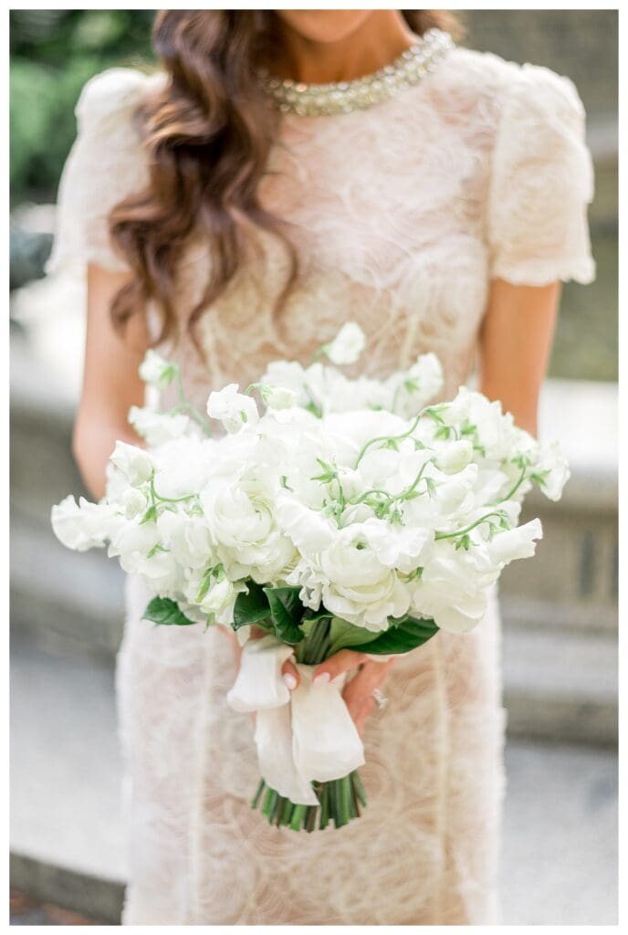 Bride holding white bouquet in the Public Garden.