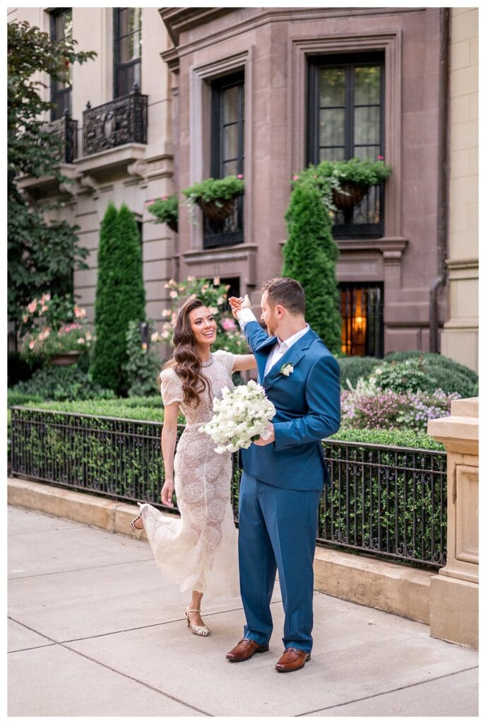 Bride twirling in lace gown on Commonwealth Avenue Mall.