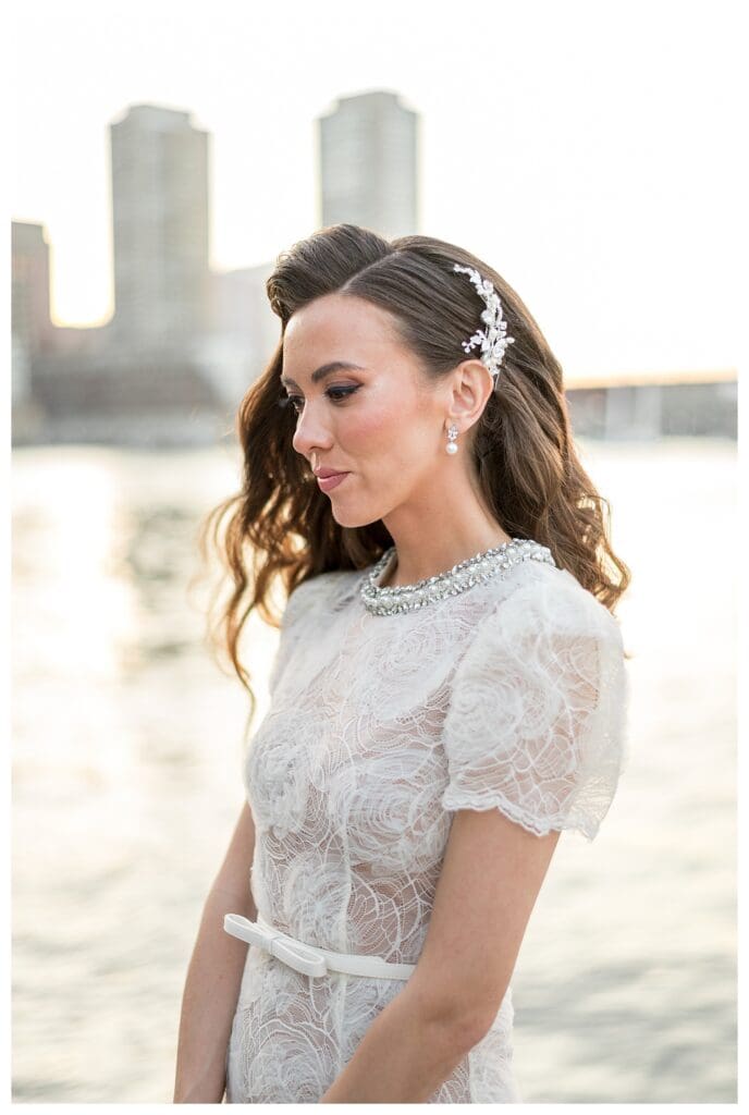 Side profile of bride with jeweled hairpiece.
