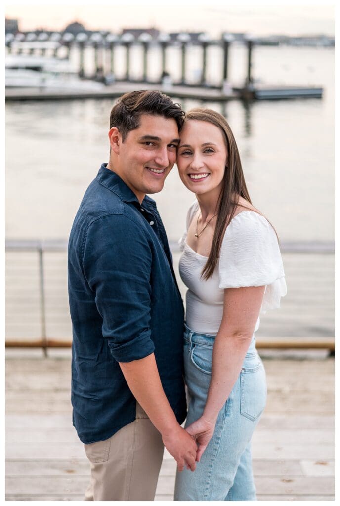 Close-up of the couple side by side smiling.