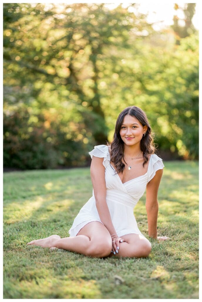Izzy smiling confidently during her senior session.