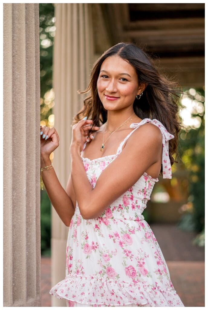 Portrait of Izzy leaning against a column at Lynch Park.