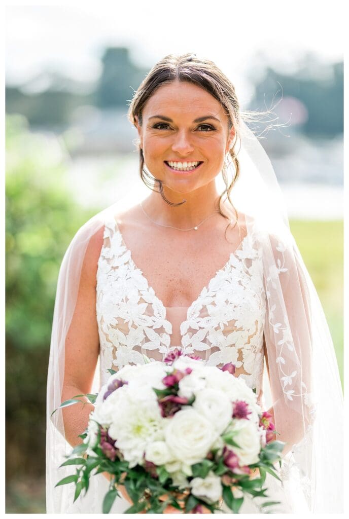 Bride holding her bouquet in front on her wedding day.
