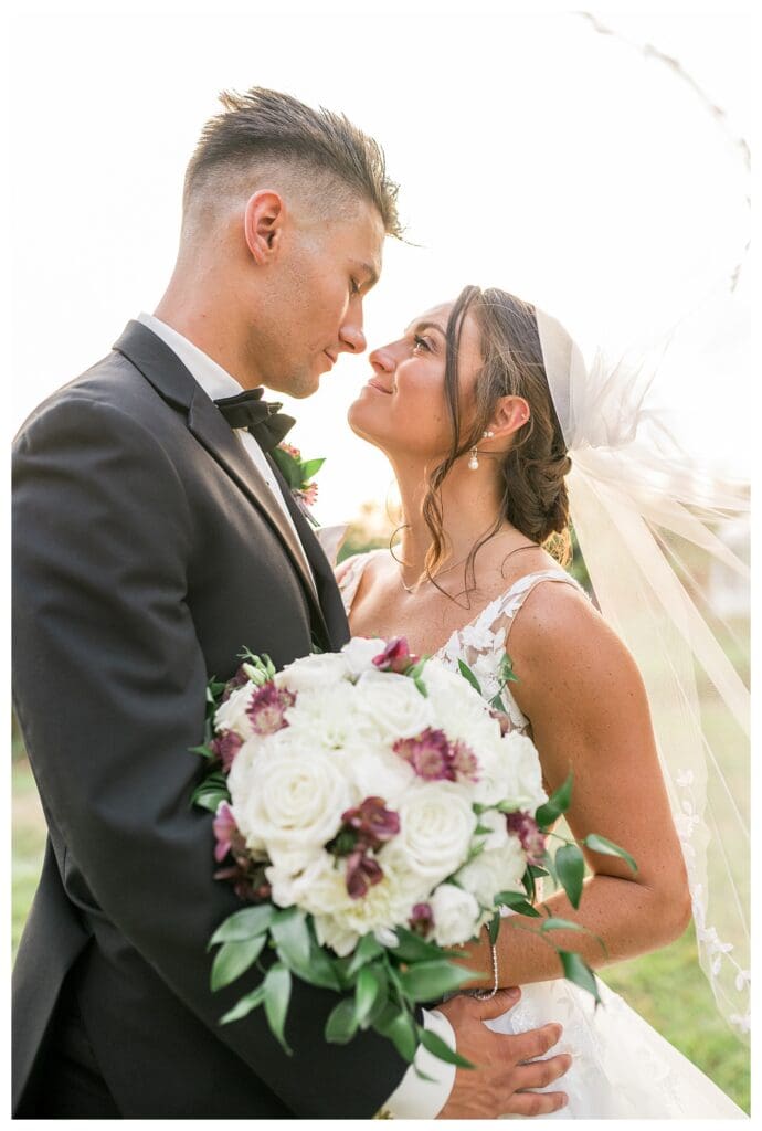 Noelle Lambert & her husband Mark, in a romantic close-up with soft sunset lighting.