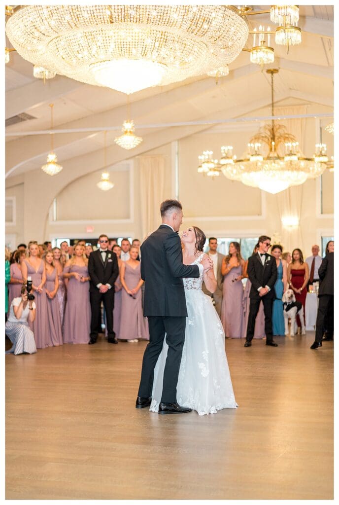 Bride and groom dancing together during reception.