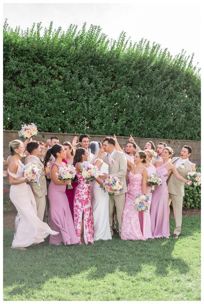 Wedding party on the Wychmere lawn in pink pastel colors.