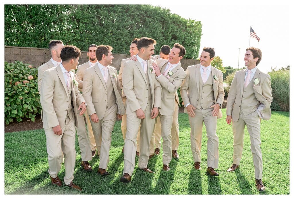 Groomsmen walking together at Wychmere.