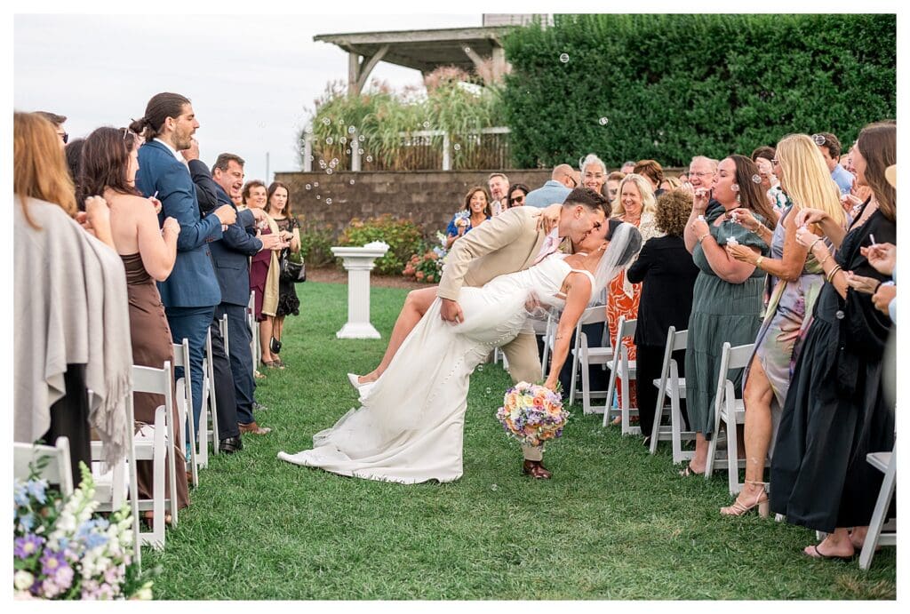 Wedding ceremony on the Hydrangea Lawn at Wychmere Beach Club.