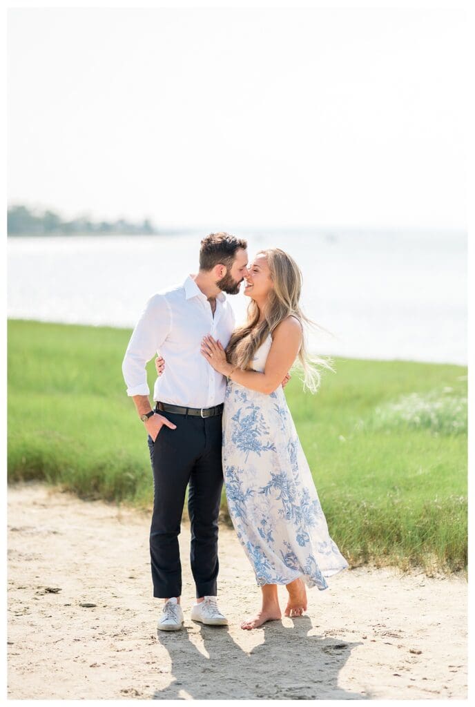 Reid holding Libby close as they smile together on the beach in Yarmouth, Cape Cod