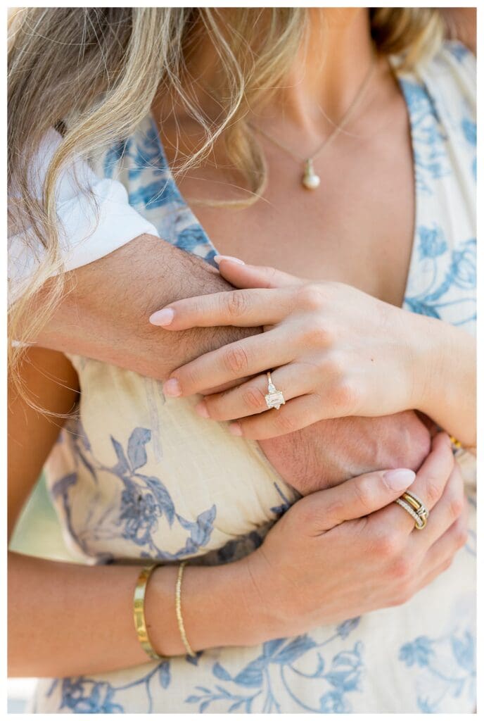 Detail shot of Libby’s ring resting in Reid’s hand after their Cape Cod proposal
