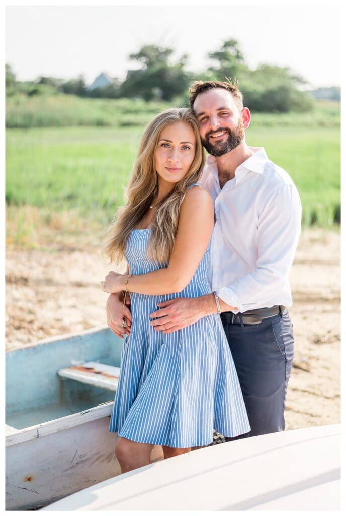 Natural candid of Reid holding Libby close during their Yarmouth engagement shoot