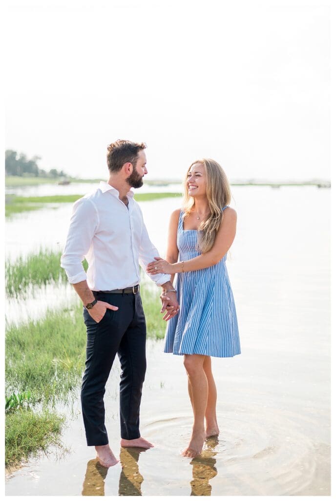 Reid and Libby walking toward the camera along the Yarmouth beach, newly engaged