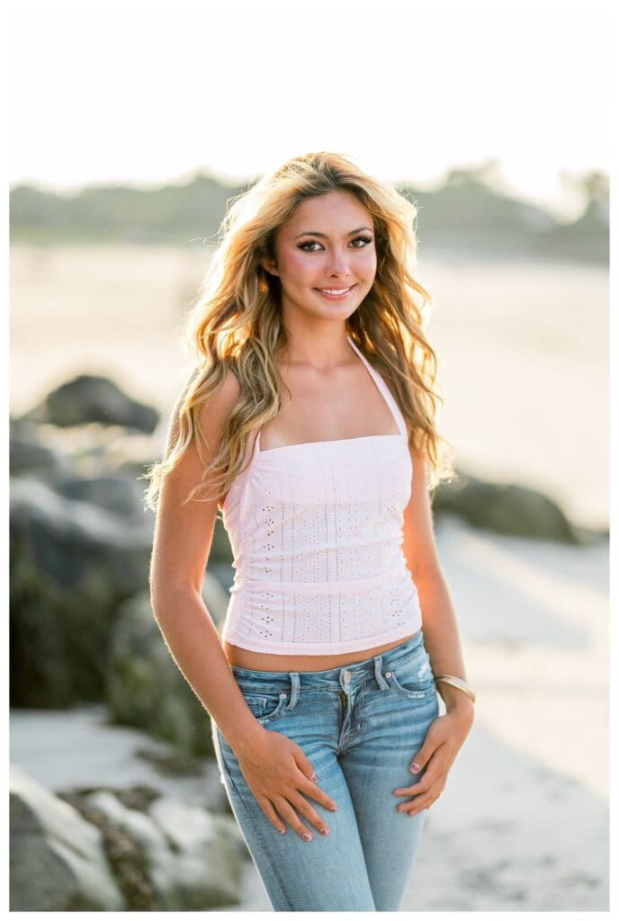 Beach senior portrait with glowing sunset light in Cohasset, MA