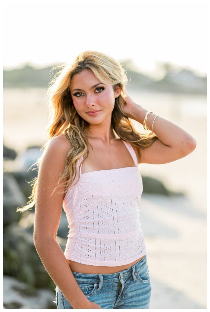Senior photos on the beach in Cohasset, MA with soft evening light