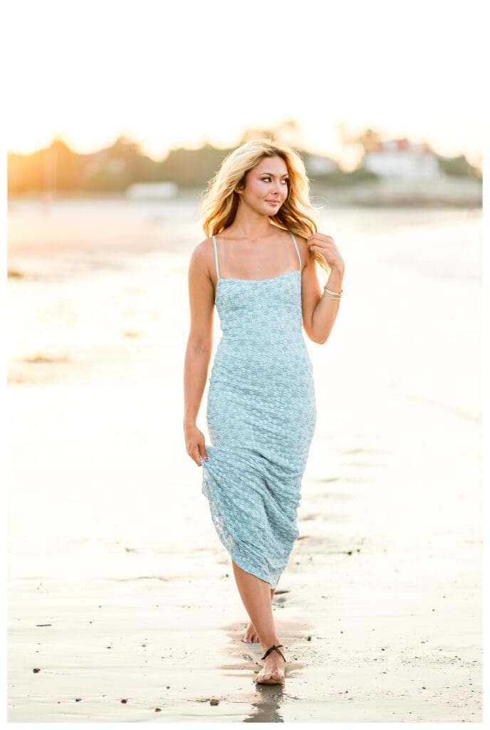 Senior portrait showcasing soft light and shoreline views in Cohasset