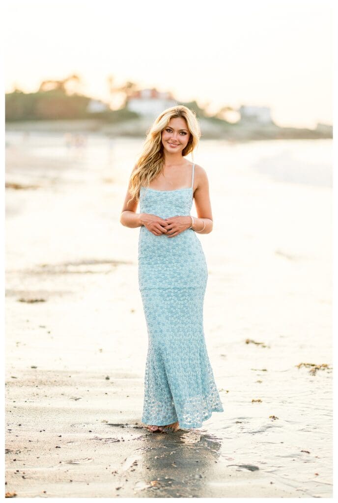 High school senior portrait with ocean breeze at a Cohasset beach
