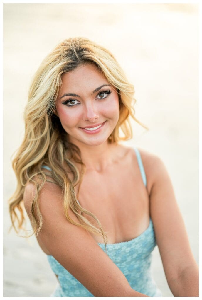 Senior portrait featuring soft light and coastal scenery in Cohasset, MA
