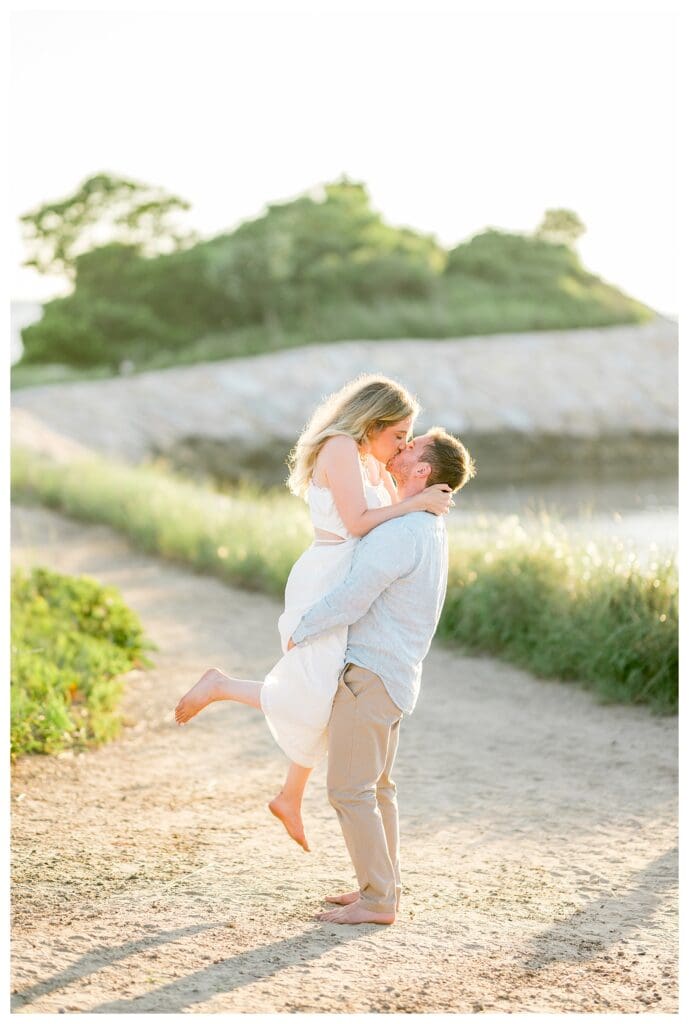 Romantic portrait of Jess and Jamie overlooking the water at The Knob on Cape Cod