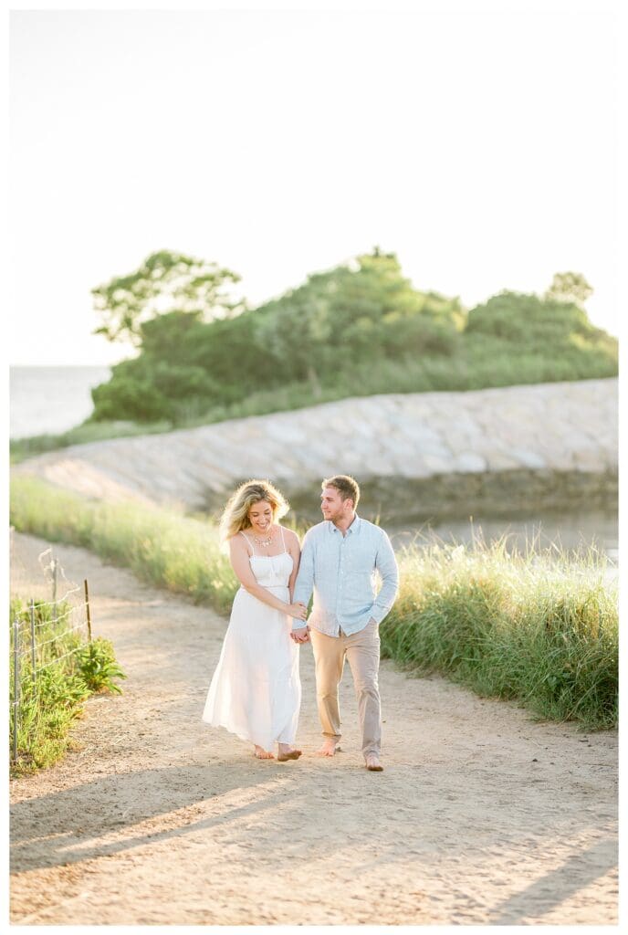 Pathway and ocean view at The Knob in Falmouth, MA during sunset engagement photos