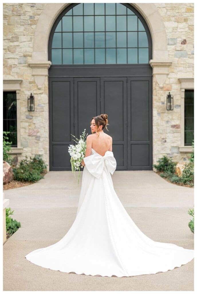 Elegant bride with a bow dress at a luxury California winery wedding at Monserate Winery.