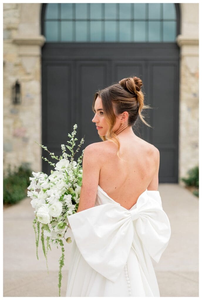 Close up of elegant wedding gown with a big bow on the back