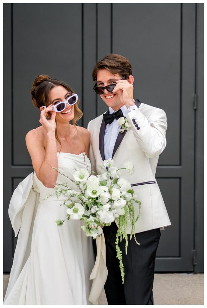 Silly bride and groom sunglasses pose