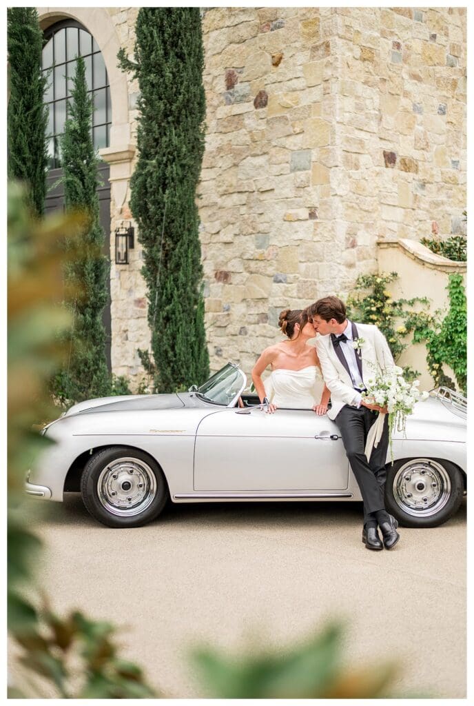 Romantic couple portrait framed by oak trees at Monserate Winery