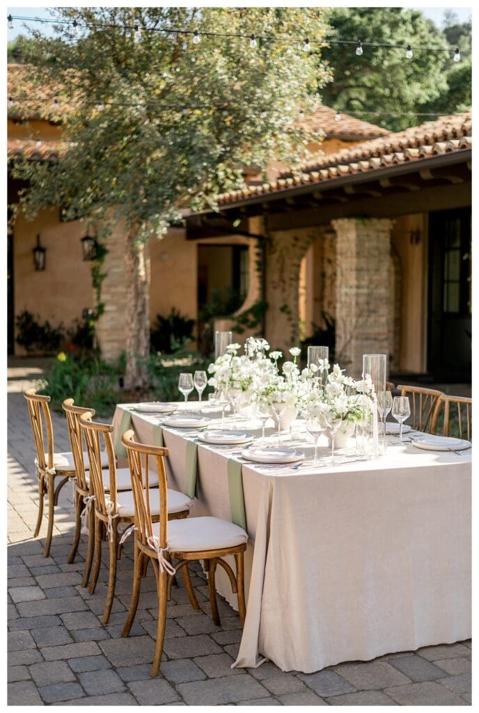 Reception tables styled with white florals at Monserate Winery wedding