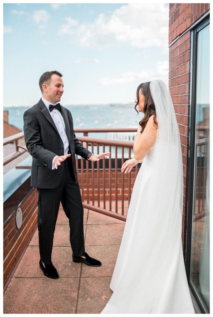 Couple laughing during intimate first look in Boston.