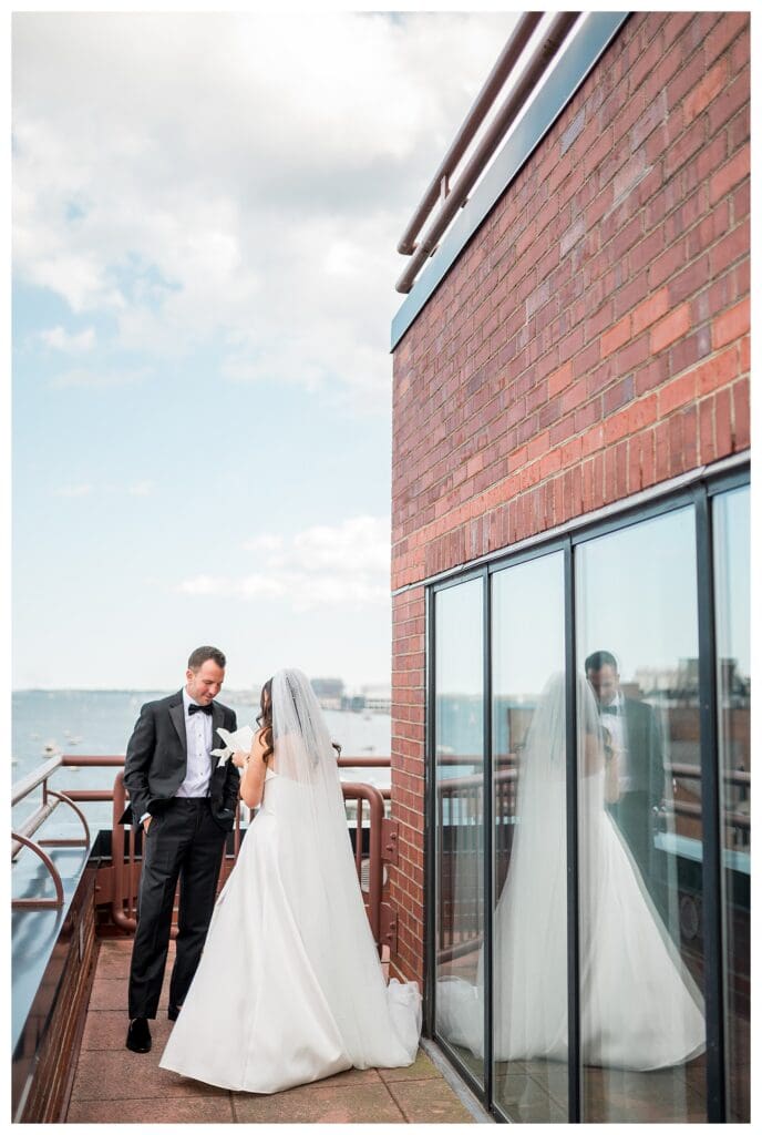 Private vow exchange overlooking Boston harbor.