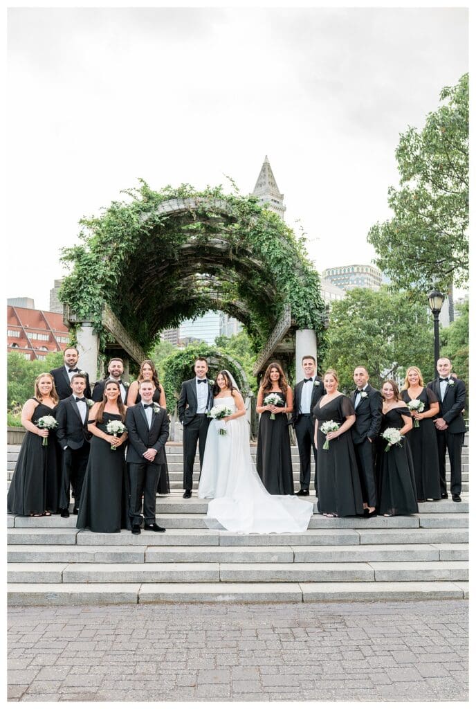 Classic Boston wedding party photo at Christopher Columbus Park.