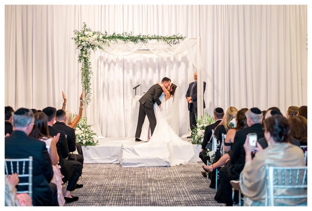 Elegant chuppah setup at Boston harbor wedding.