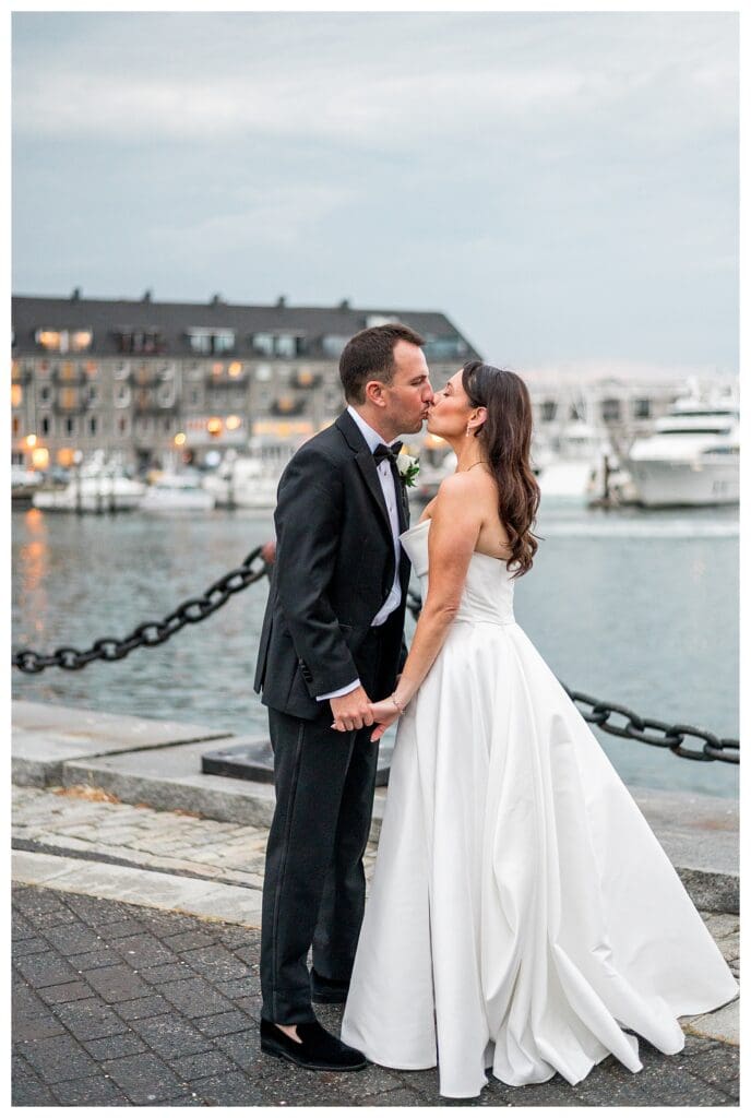 Elegant Boston Wedding portrait with skyline and water views.
