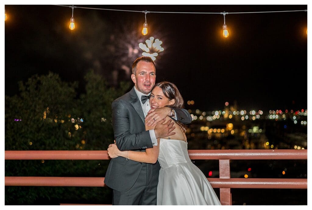 Nighttime balcony portrait at Boston Marriott Long Wharf overlooking Boston harbor.