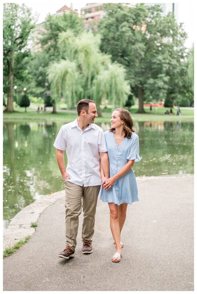 Couple walking together in Boston Public Garden during engagement session, Boston engagement photos