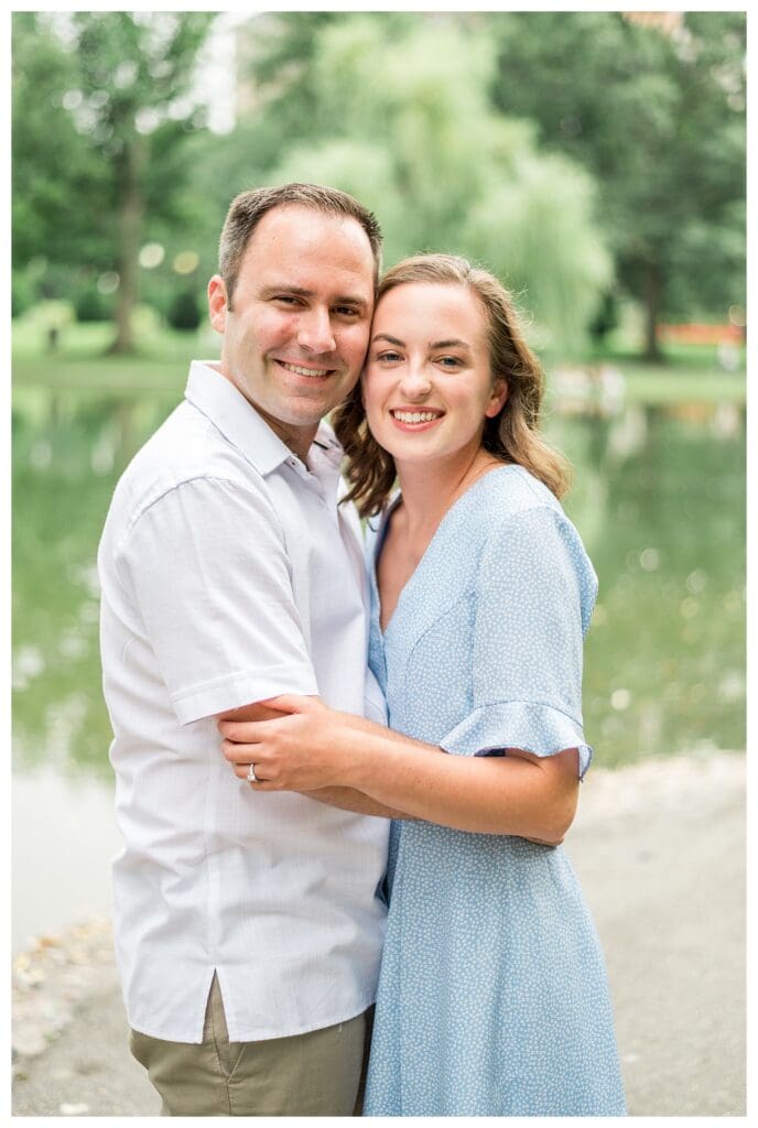 Romantic close-up of couple embracing near bridge in Boston Public Garden