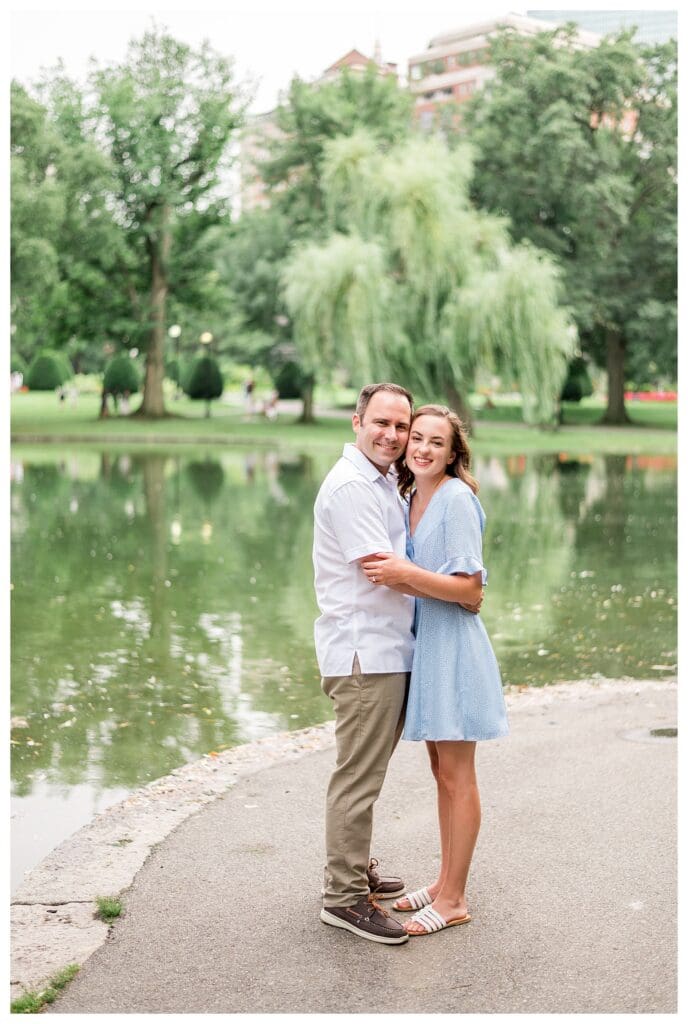 Close-up of couple smiling together by water in Boston Public Garden, Boston photographer