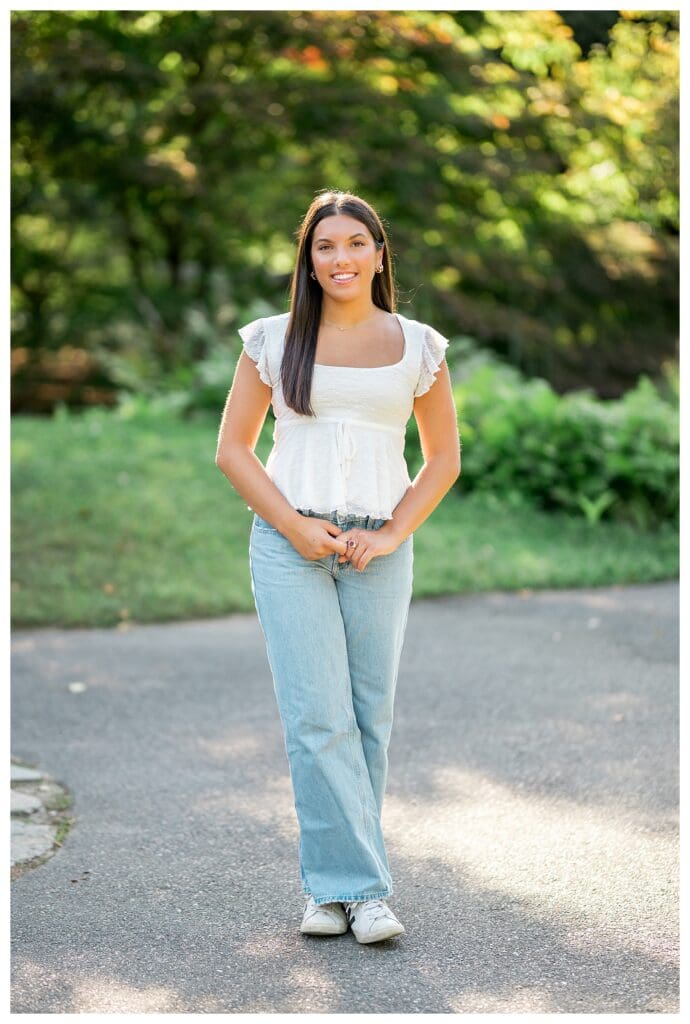 Dana Hall senior portrait with soft greenery and warm light
