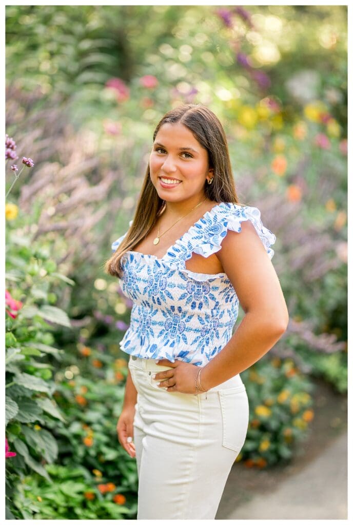 Senior girl portrait with soft pink flowers at Elm Bank