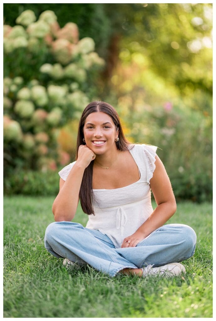 Close up senior portrait with soft glow and greenery