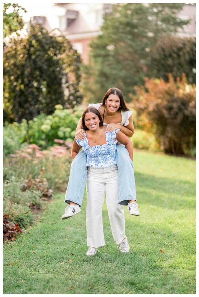 Twin sister seniors doing a piggyback