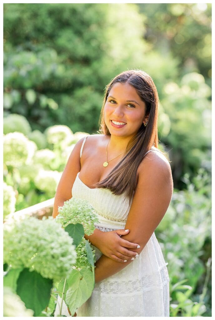 Natural senior photos with hydrangeas at Elm Bank