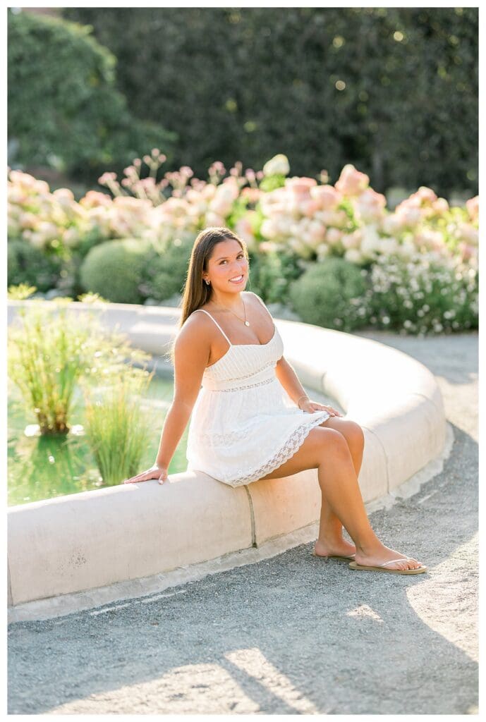 Senior girl portrait with flowers and soft blurred background