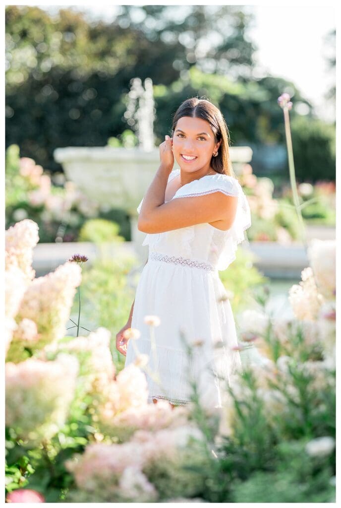 Senior girl portrait with soft pink and green tones