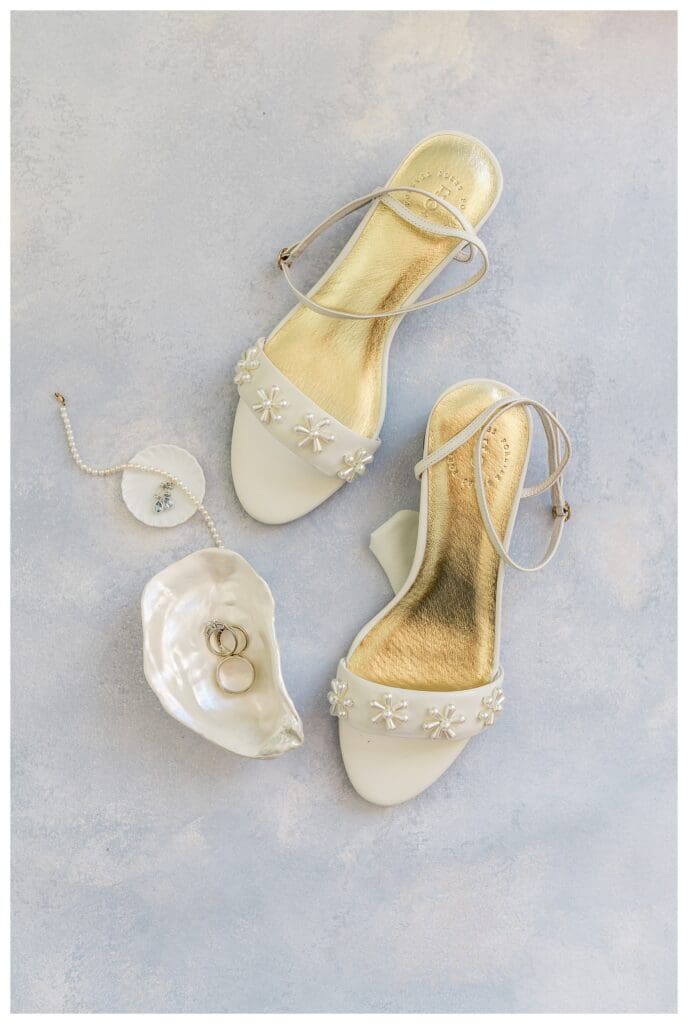 Bride’s wedding shoes and accessories flat lay
