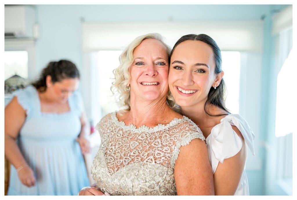 Bride smiling with her mom during getting ready