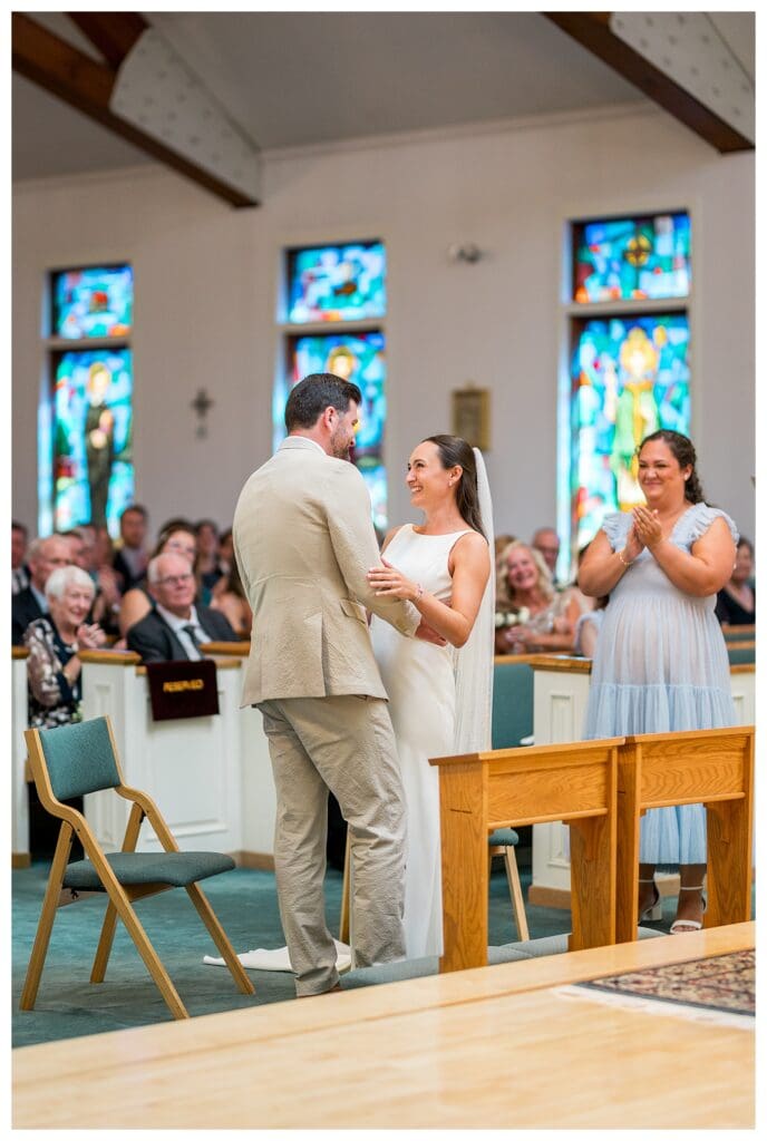 Couple exchanging vows during church wedding