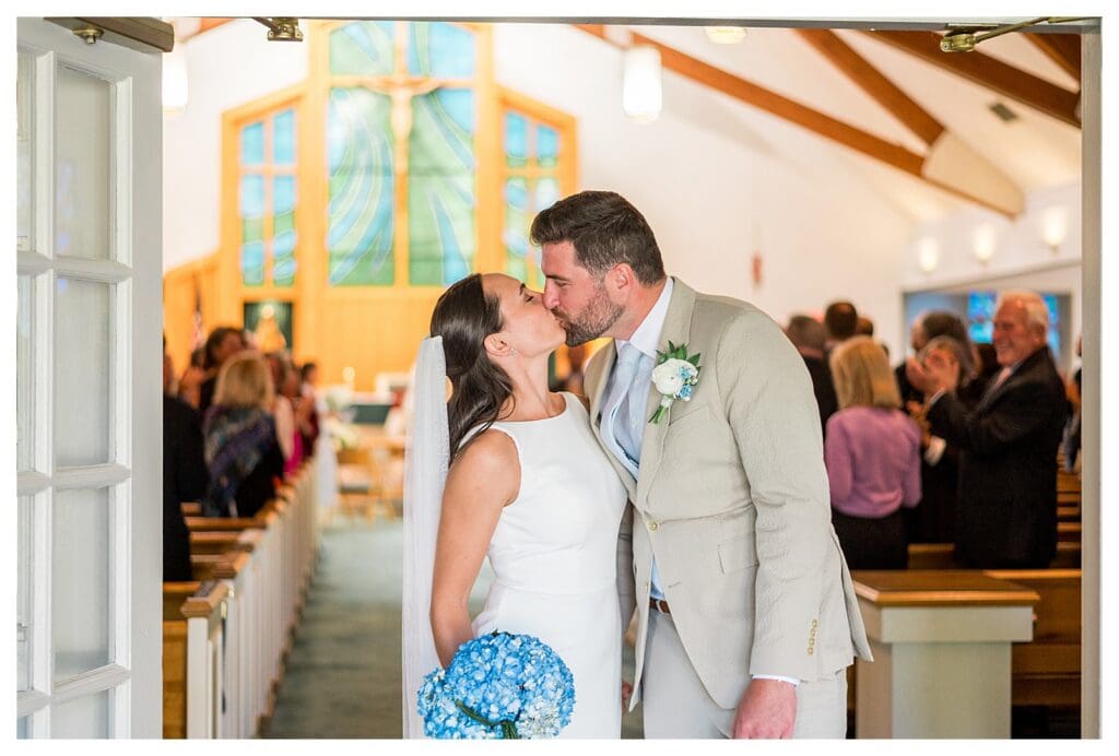 Couple walking down aisle after ceremony