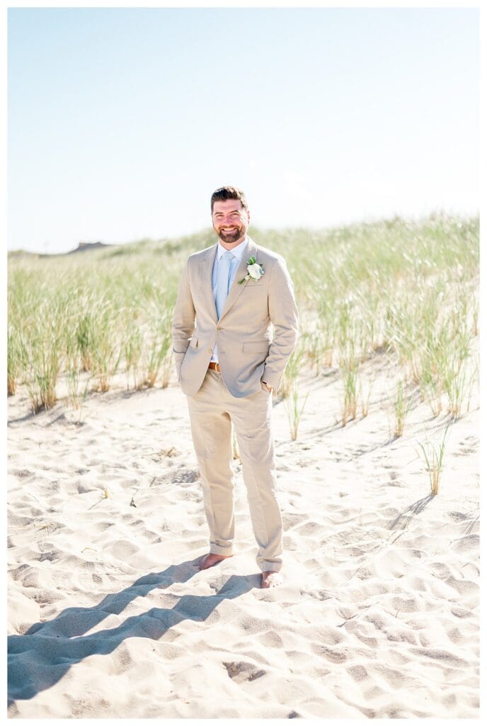 Beach groom in a tan suit
